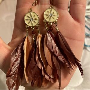 A pair of feather earrings